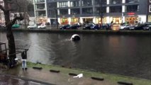 Four men save woman and child from sinking car in Amsterdam