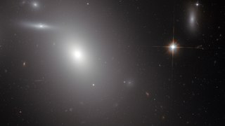 Panning across the elliptical galaxy NGC 4889