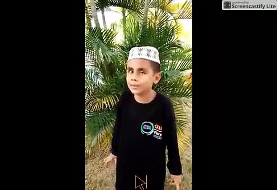 A BOY RECITING A QURANIC VERSES