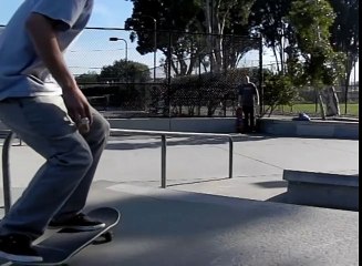 BACKSIDE 50-50 RAIL SLOW MOTION