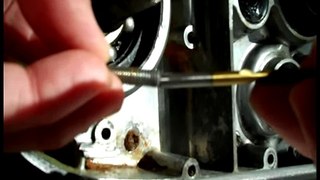 Using a left hand drill bit to remove a buggered screw