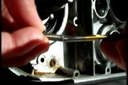 Using a left hand drill bit to remove a buggered screw