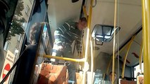 A drug addict goes crazy in the city bus  in Poland.