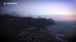 Timelapse shows clouds blow from top of Table Mountain as sun sets