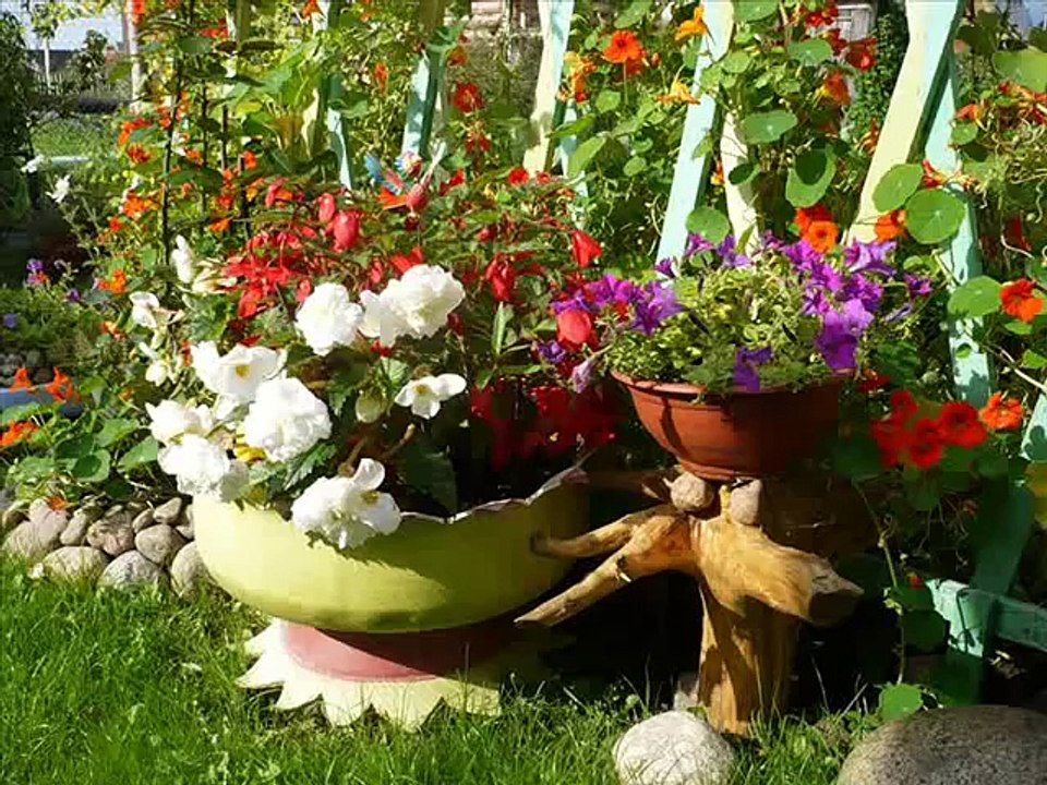 Веселые клумбы из покрышек. Клумбы из шин
