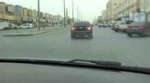 black Chevrolet drifting while police on the road