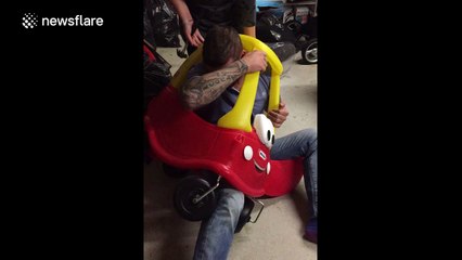 Man man gets stuck in a toy car in Scotland