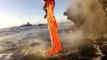 Lava flowing into sea by The Earth