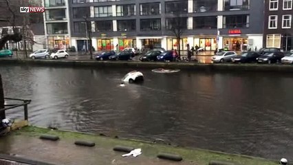 Dramatic Rescue Of Mother And Child From Sinking Car in Amsterdam