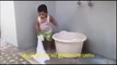 chubby indian baby washing clothes - funny kid kerala india