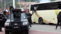 Malaysian swat forces raid a bus during a mock hostage situation