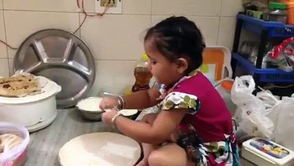 Cute little girl making bread