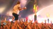 Rock Singer Catches Beer While Crowdwalking