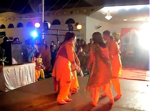Mehndi dance with dancing sticks, cultural Pakistani wedding dance