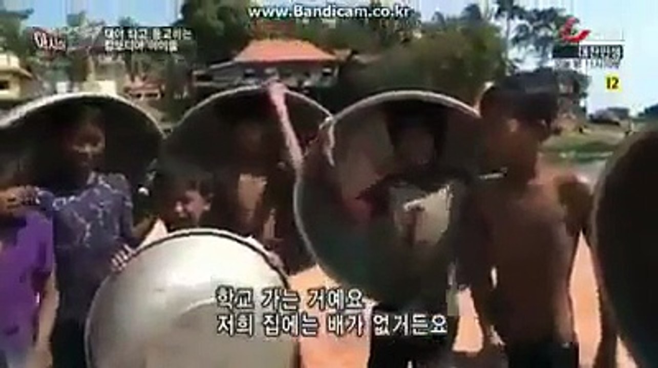 Khmer student have to ride a big pan cross the river to study