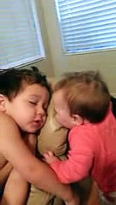 Baby sister tries to wake her big brother