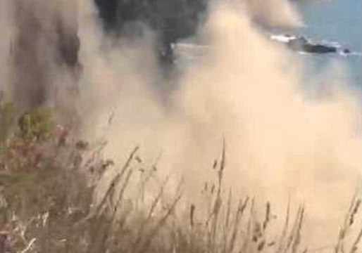 Dust Clouds Rise Following Christchurch Earthquake Cliff Collapse