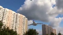 This Plane lands only a few meters above Buildings!!