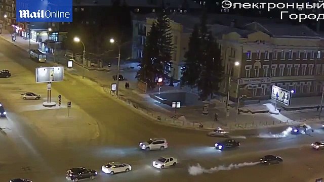 Police officer clings to car bonnet as suspect speeds off