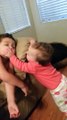 Baby sister tries to wake her big brother