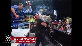 WWE Network- Big Show chokeslams Brock Lesnar through the announce table- SmackDown,