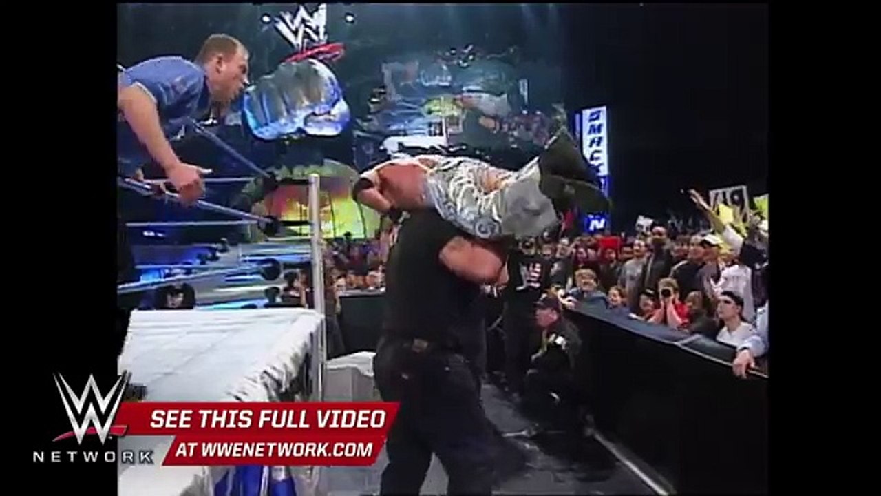 WWE Network- Big Show chokeslams Brock Lesnar through the announce table- SmackDown,
