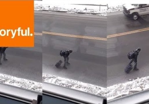 Man Skates on Icy Streets With Suitcase