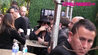 Johnny Depp in the community of Joe Perry in a cafe after a concert at the Grammys 2016