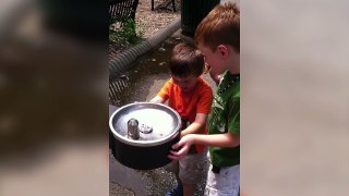 Little Boy Adorably Tries to Water Fountain