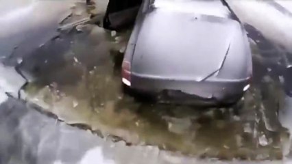 Idiot Tries To Jump Thin Ice In His SUV