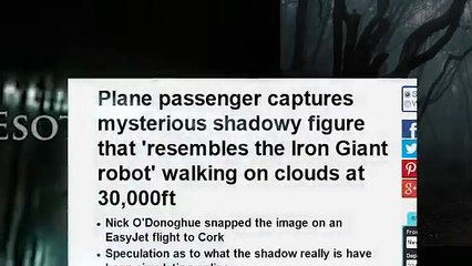 ENORMOUS SHADOWY FIGURE walking on clouds CAUGHT ON CAMERA by Plane passenger at 30,000ft