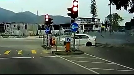 Car smashes into traffic Lights as couple wait to cross