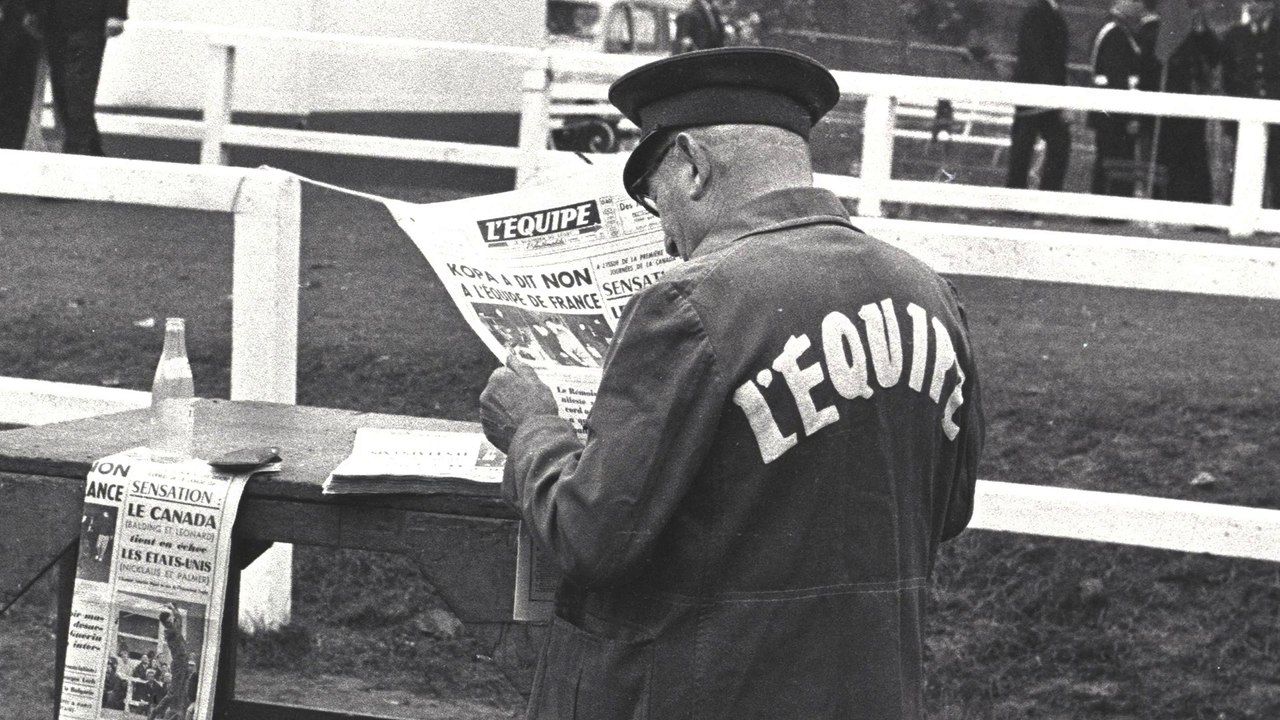 Lisant L' Equipe