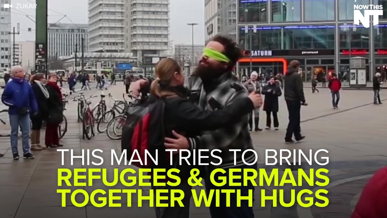 This Man Tries To Bring Refugees & Germans Together With Hugs