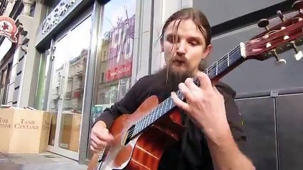 At first I thought he was a homeless man with a guitar. Suddenly he did THIS.