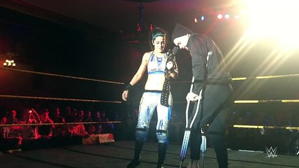 Bayley cheers Finn Bálor up after his injury at NXT Live