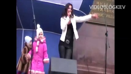 brunette girl dancing in latex and black mini skirt