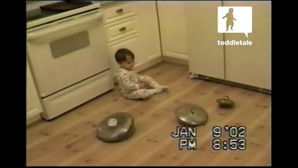 Little boy attempts to have all pan lids spin at same time - Funny - toddletale