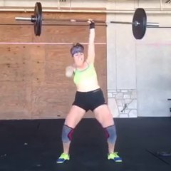 One-Armed Female Weightlifter Performs Barbell Clean and Press