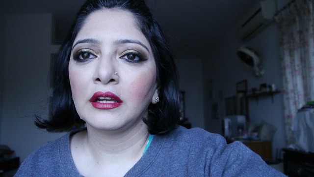 pakistani/indian bridal makeup with gold and bronze eyes with a red lip