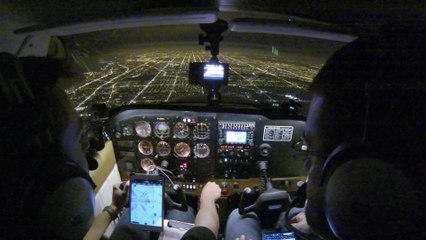 2 Guys fly over Chicago by Night and land small Cessna Plane at O'Hare international Airport
