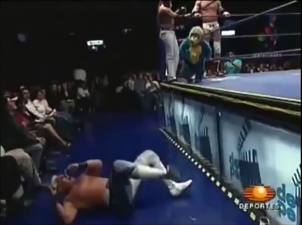 Wrestler Drop Kicks Midget in Monkey Suit