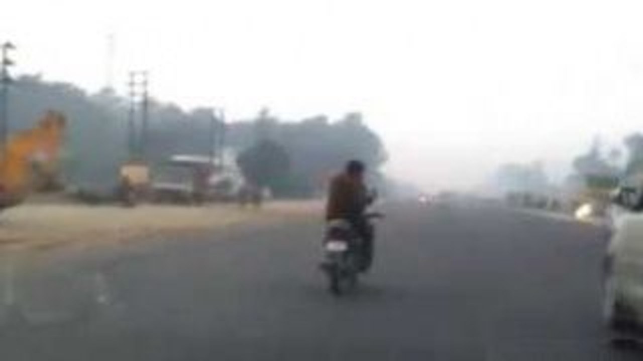 Bike Stunts While Chatting On Mobile