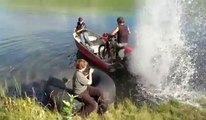 Driving a motorcycle modified Boat on a lake... Crazy guys!