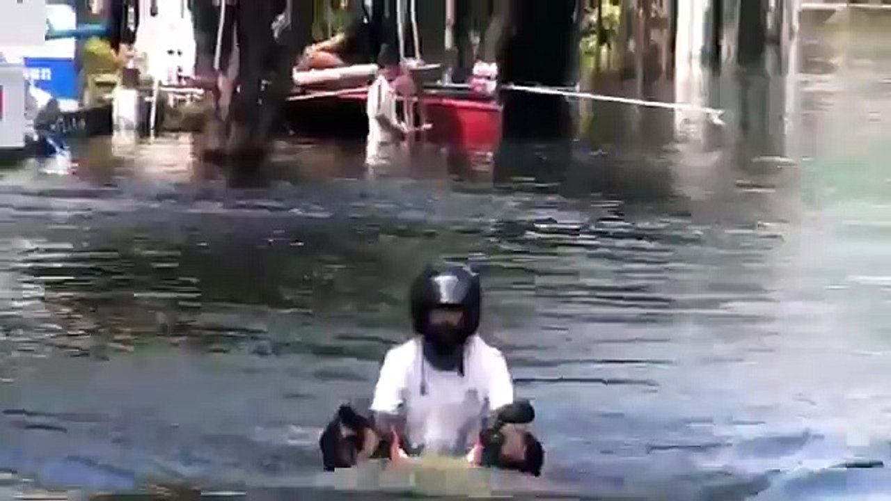 Motorbike Driver Ignores Flood