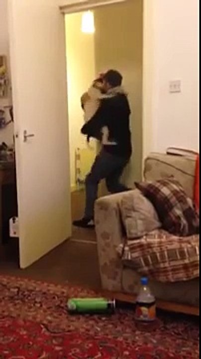Dog is hugging a man, when it came home