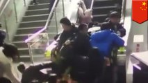 Escalator goes in reverse, sending Chinese shoppers tumbling down