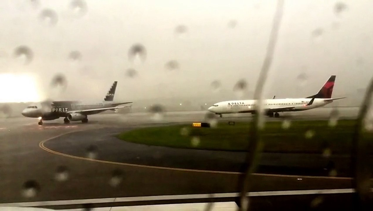 Bolt of lightning strikes Delta Airlines plane during thunderstorms at Atlanta airport