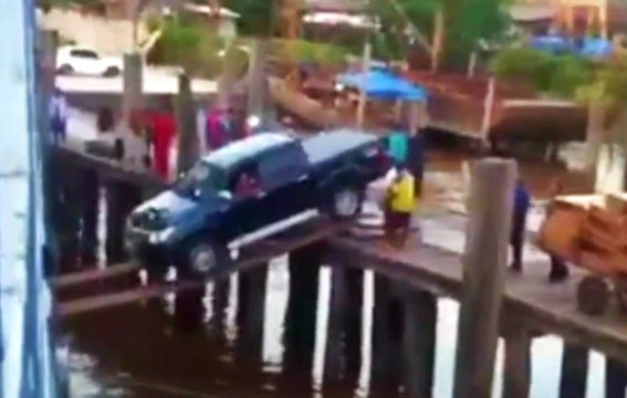 Loading A Truck Onto A Ship With Wooden Planks