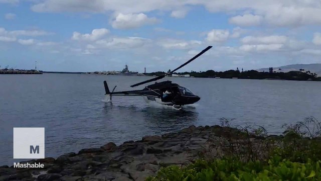 Footage of the moment a tourist helicopter crashed into Hawaii's Pearl Harbor